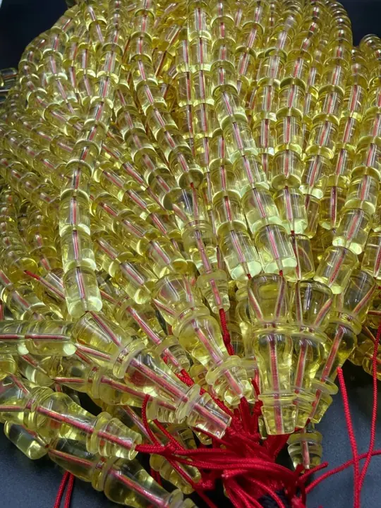 Bundled — amber misbaha strands in production quantity at the VIAMBER atelier