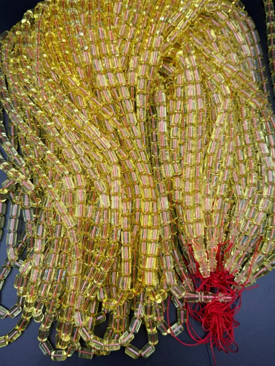 Tied off — amber misbaha strands in production quantity at the VIAMBER atelier