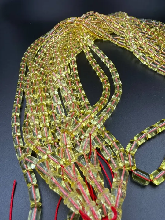 Falling — amber misbaha strands in production quantity at the VIAMBER atelier
